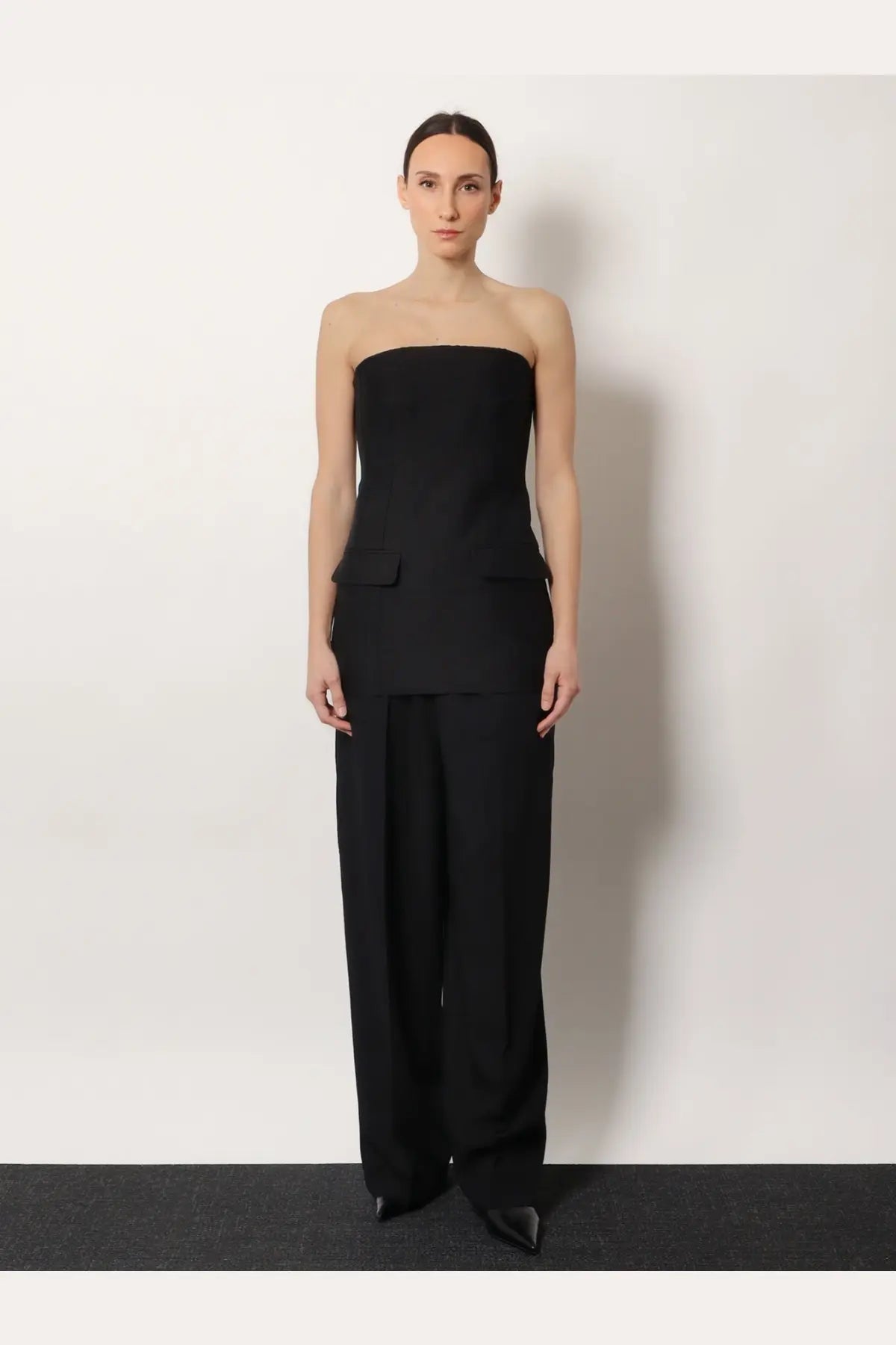 Toteme women’s black viscose and wool trousers with a structured waist paired with a matching strapless top