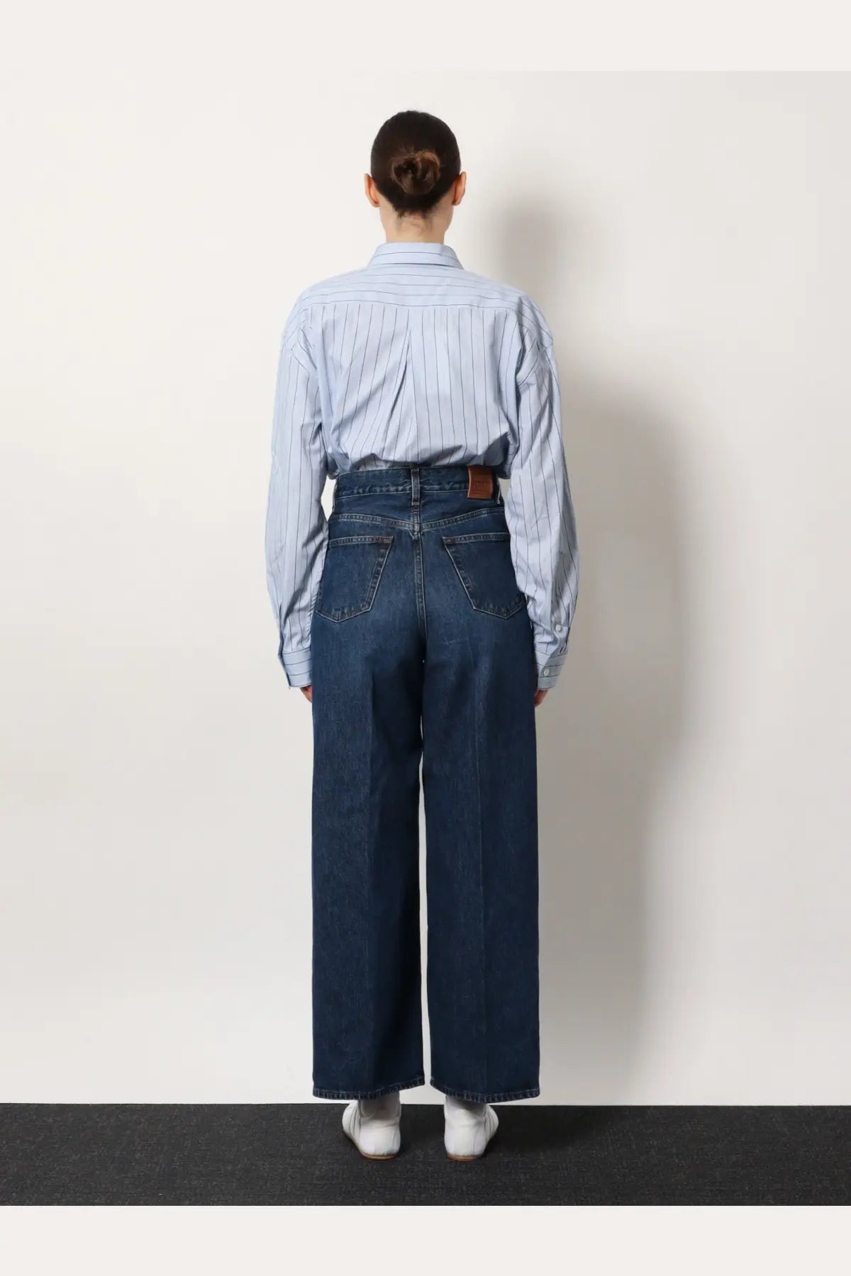 Toteme women’s wide leg organic cotton jeans in blue with high waisted fit dark blue denim and brown leather belt loop