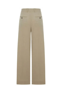 Beige wool blend tailored wide-leg trousers with subtle front pleats from Toteme women’s collection