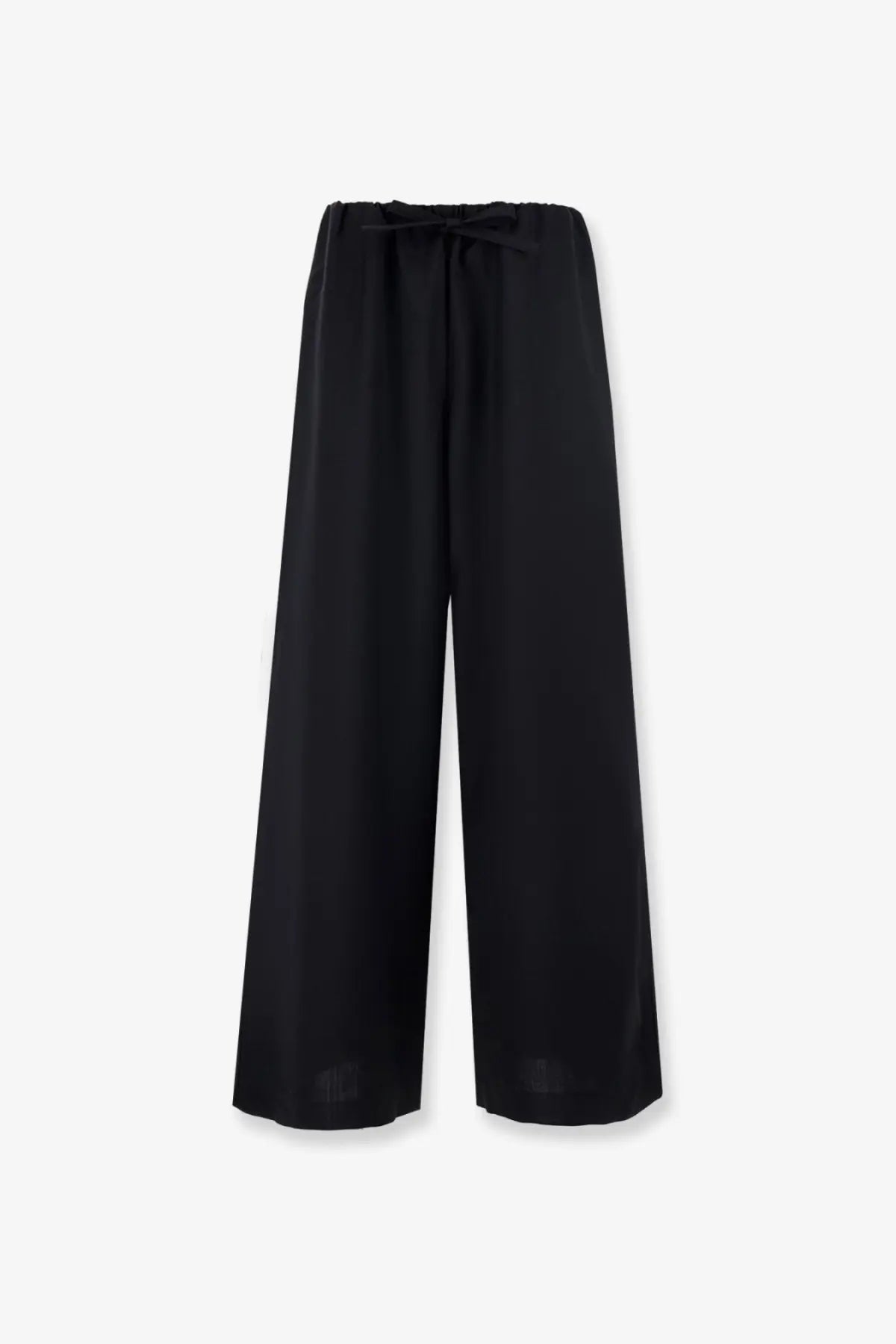 Toteme women’s black wool wide-leg trousers with soft flowing fabric and elastic waistband tied into a bow