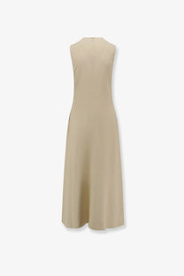 Toteme women’s sleeveless beige viscose dress with knee-length hem, subtle side slit, and simple back zipper shown from back