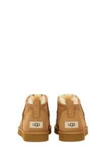 Ugg men’s stivale classic ultra mini brown booties with tan suede exterior and plush white shearling lining