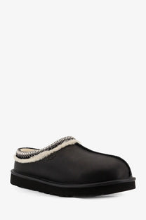 Ugg men’s tasman noir leather slip black with plush white shearling lining and silver-toned woven trim