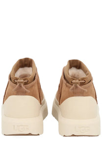 Ugg men’s ultra mini weather hybrid boots in tan suede with cream rubber sole and fluffy lining visible from the back