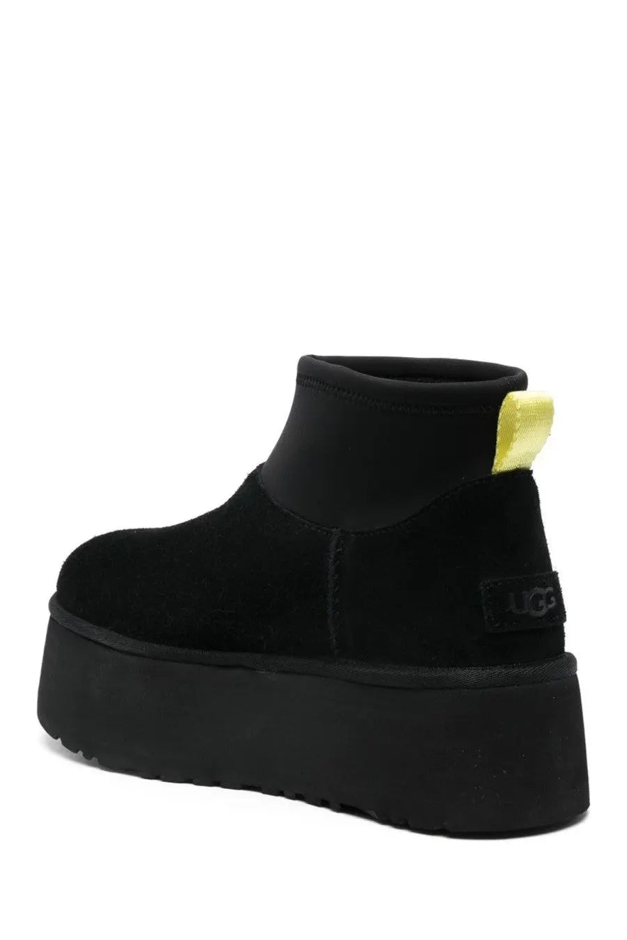 Ugg women’s classic mini dipper black boot with suede upper neon yellow pull tab and platform sole back view