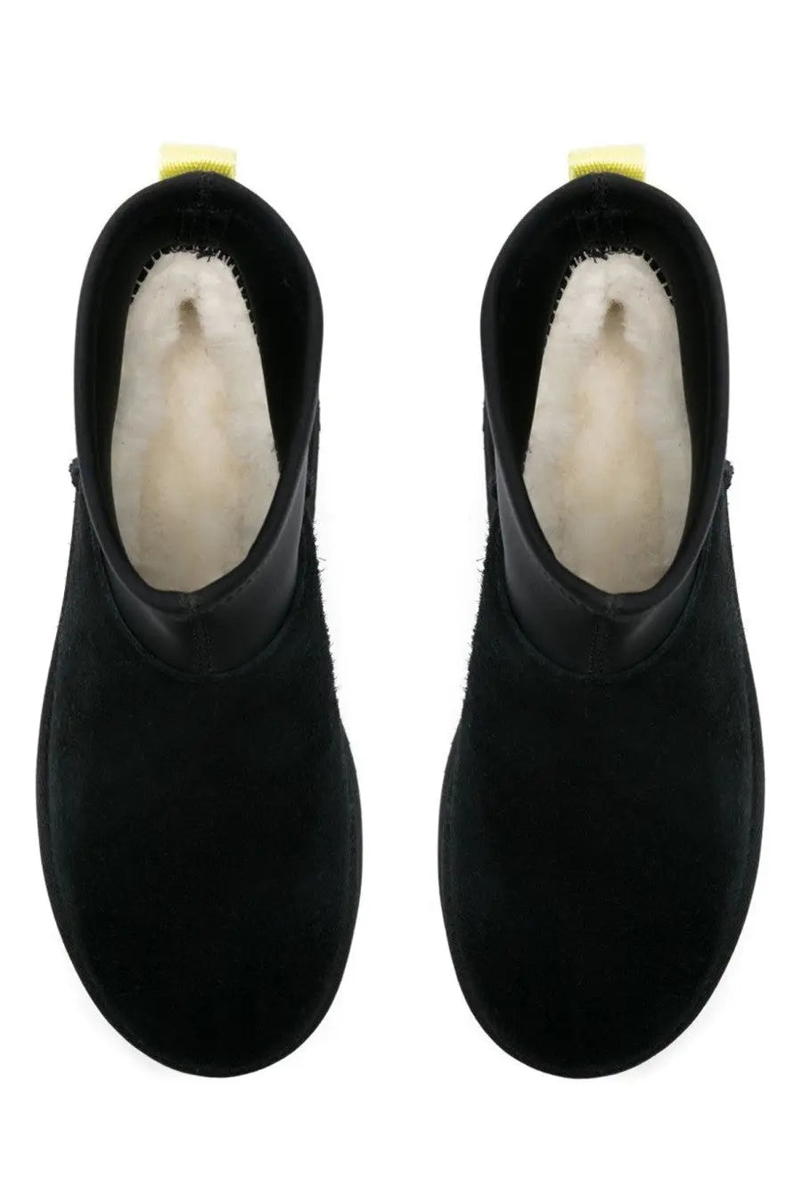 Ugg women’s classic mini dipper black ankle boots in suede with plush white shearling lining and yellow heel tabs