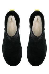 Ugg women’s classic mini dipper black ankle boots in suede with plush white shearling lining and yellow heel tabs