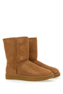 Ugg women’s classic short brown boot in tan suede with a cozy design and durable rubber soles