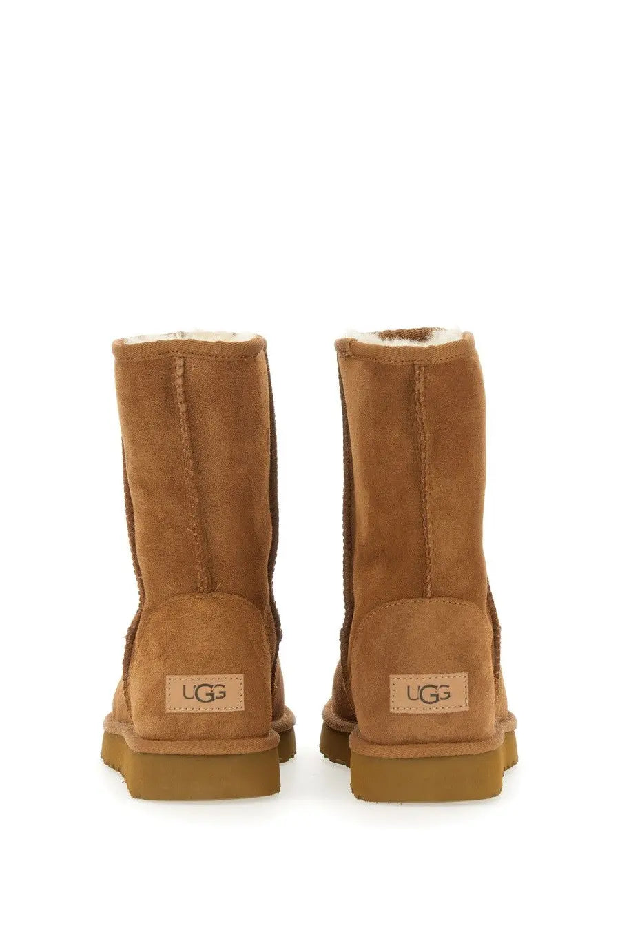 Ugg women’s boot classic short brown tan suede with plush white lining and cozy classic design