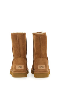 Ugg women’s boot classic short brown tan suede with plush white lining and cozy classic design