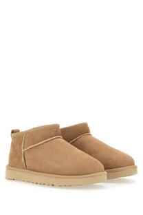 Ugg women’s boot classic ultra mini beige tan suede boots with plush upper and chunky rubber sole
