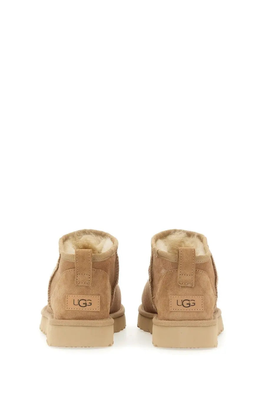 Ugg women’s boot classic ultra mini beige tan suede with plush shearling lining and chunky rubber sole front view
