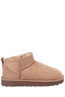 Ugg women’s classic ultra mini beige boot in tan suede with plush shearling lining and brown rubber sole