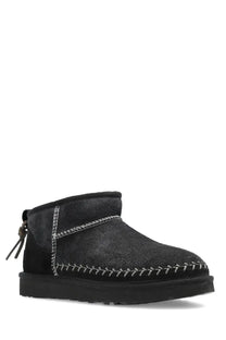 Back view of ugg womens classic ultra mini biarritz black boot in black suede with white stitching and pull tab