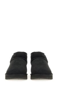 Ugg women’s boot classic ultra mini black suede booties with plush interior and stitched detailing