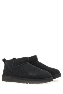 Ugg women’s classic ultra mini black boots in black suede with plush interior and stitched detailing