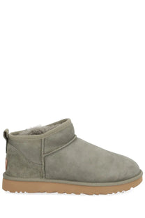Ugg women’s classic ultra mini boot in green with gray suede exterior plush shearling lining and tan rubber sole