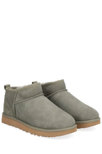 Ugg women’s ankle boots classic ultra mini in gray suede with plush interior and tan rubber soles