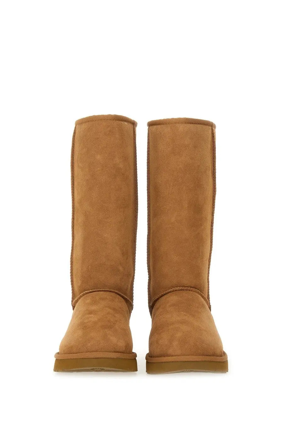 Ugg women’s boot classic tall brown featuring tan suede ugg booties with classic cozy design and sturdy rubber soles