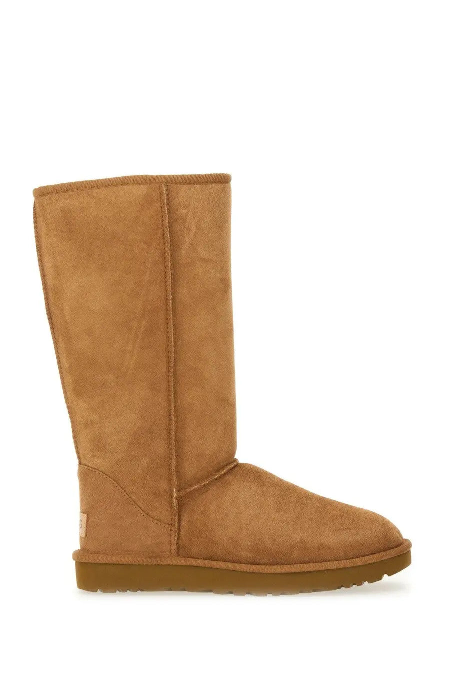 Ugg women’s classic tall brown boot in tan suede with a sturdy rubber sole for durable comfort
