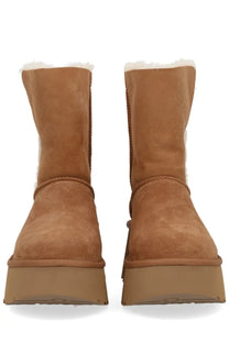 Ugg women’s boot Esmee brown tan suede with white shearling lining and chunky platform sole front view
