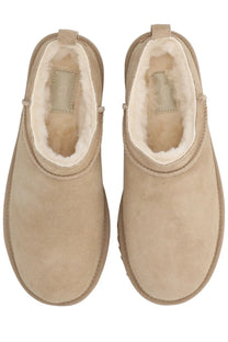 Ugg women’s classic micro beige booties made of suede with plush white shearling lining for warmth and comfort