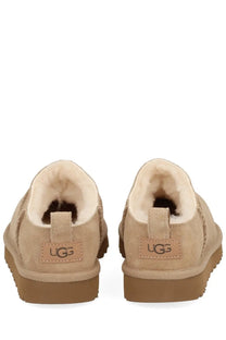 Ugg women’s classic micro boots beige with beige suede slip-on design and plush shearling lining with tan rubber sole