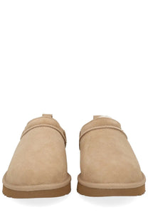 Ugg women’s classic micro boots beige slip-on moccasins with beige suede, plush interior, and tan rubber soles