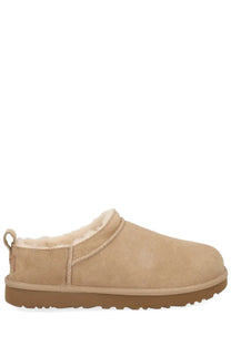 Ugg women’s classic micro boots in beige suede slip-on mule style with plush shearling lining and tan rubber sole