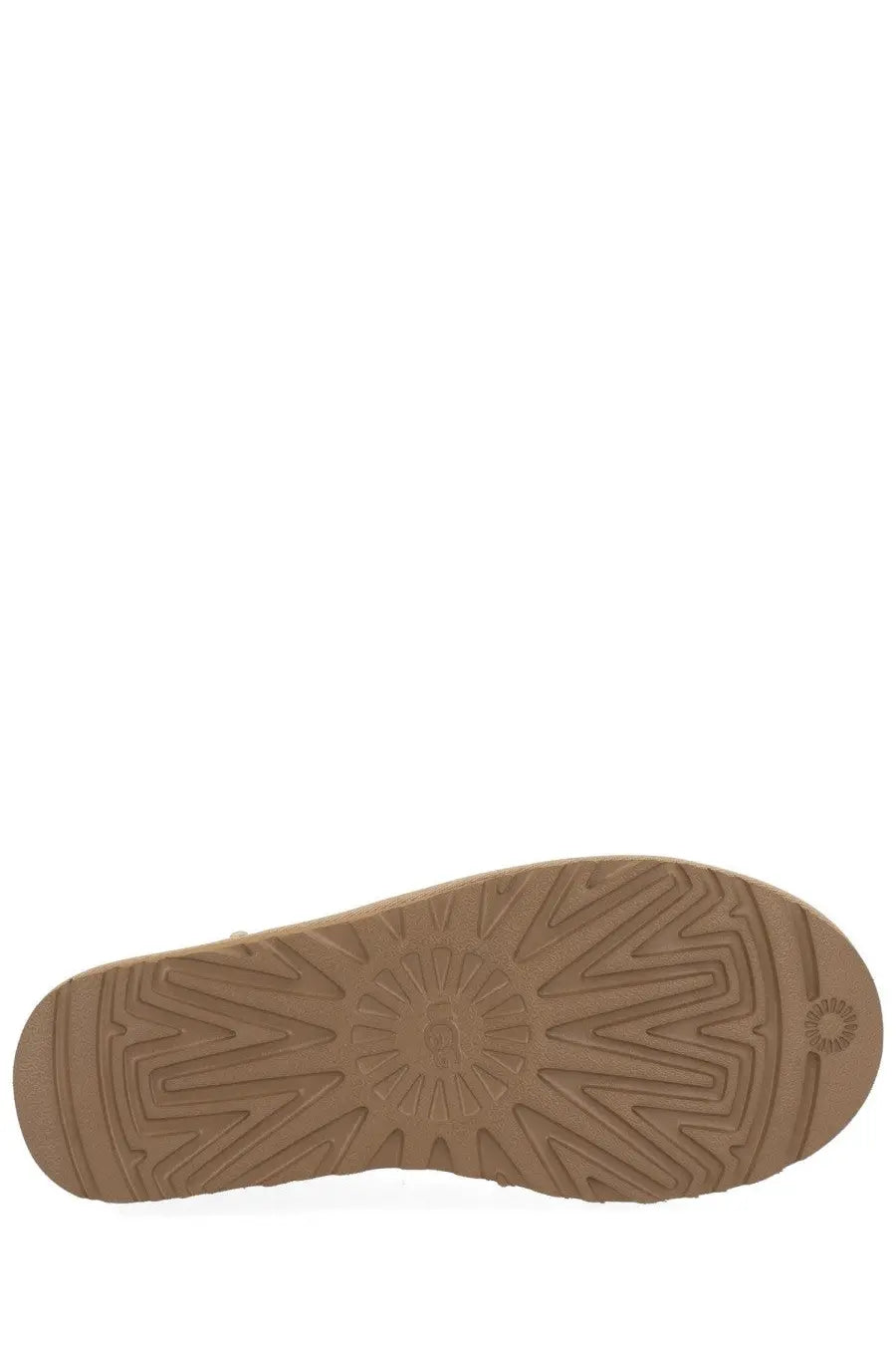 Tan rubber sole with geometric tread pattern and ugg logo embossed near the heel of ugg women’s classic micro boots beige back view