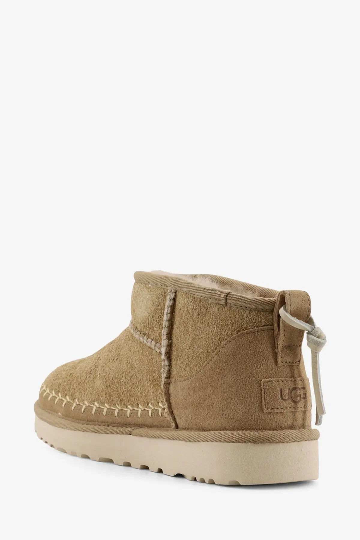 Ugg women’s classic ultra mini biarritz yellow suede ankle boots with tan suede, plush interior, and contrasting stitching