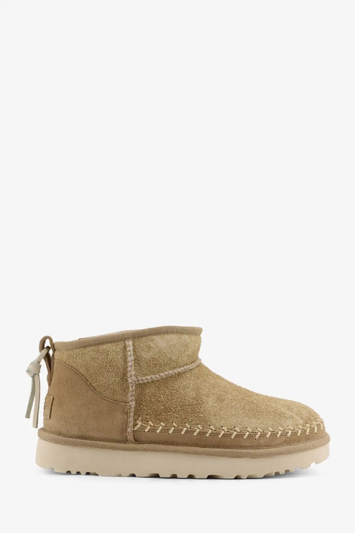 Ugg women’s classic ultra mini biarritz tan suede ankle boot with light rubber sole and decorative stitching