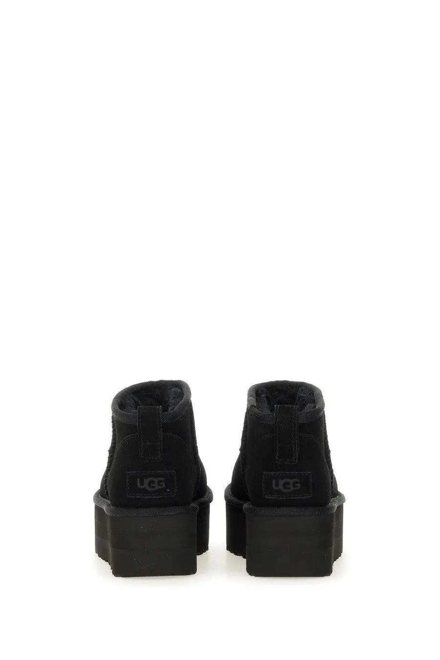 Ugg women’s classic ultra mini boot black featuring black suede upper and thick rubber platform sole