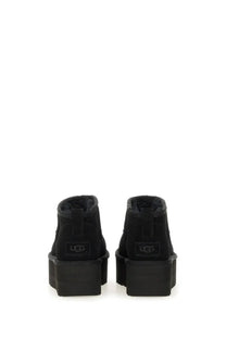 Ugg women’s classic ultra mini boot black featuring black suede upper and thick rubber platform sole