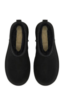 Black suede ugg women’s classic ultra mini boot with plush beige lining for cozy stylish wear