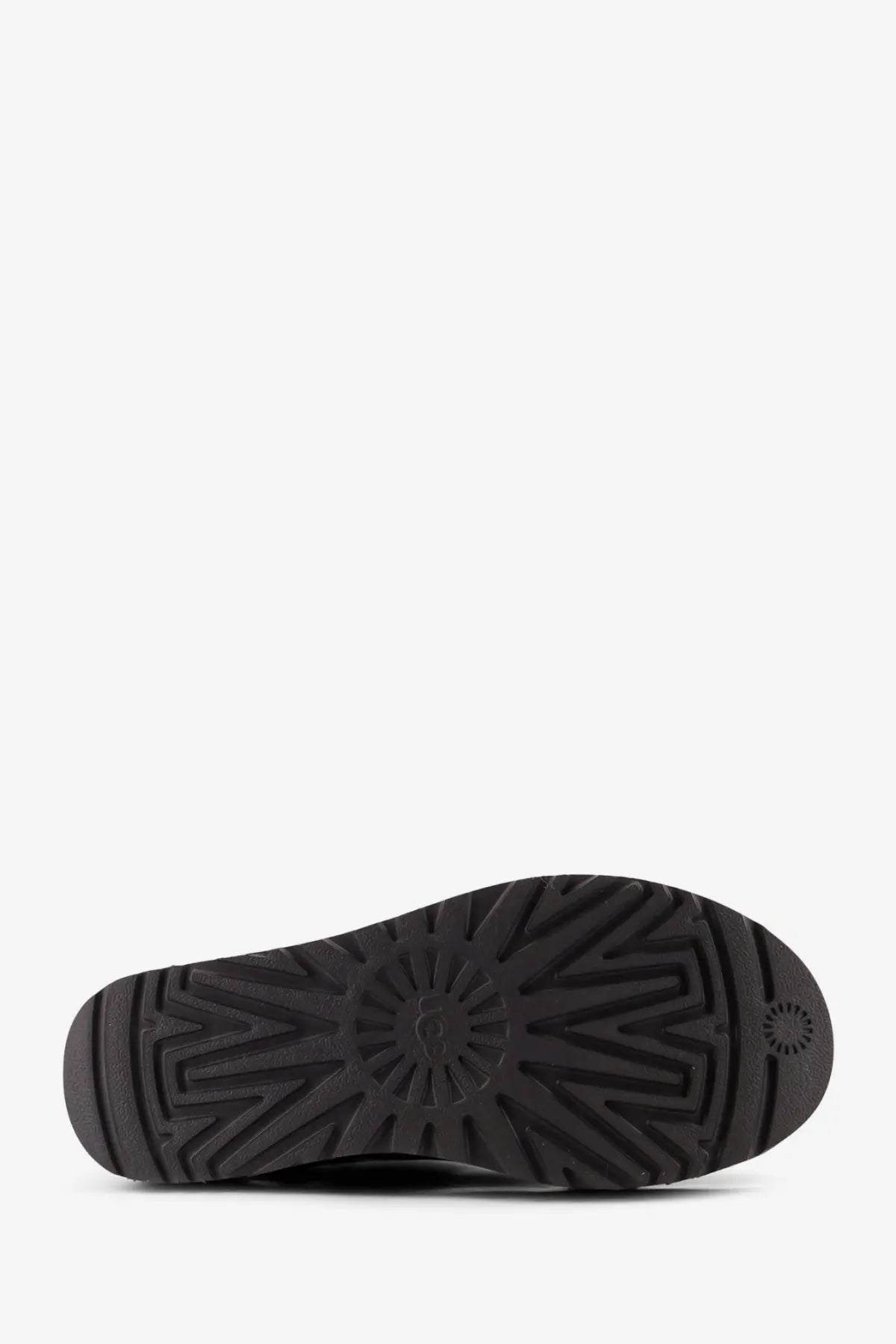 Black rubber sole of ugg womens classic ultra mini platform grey suede ankle boots with sunburst tread pattern