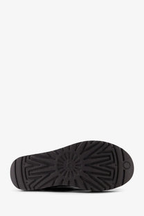 Black rubber sole of ugg womens classic ultra mini platform grey suede ankle boots with sunburst tread pattern