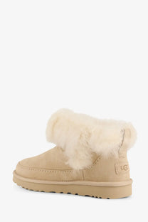 Ugg women’s classic ultra mini beige suede boots with plush white shearling lining and chunky rubber sole
