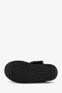 Ugg women’s disquette chalet suede mules in black with plush fur trim and textured rubber sole
