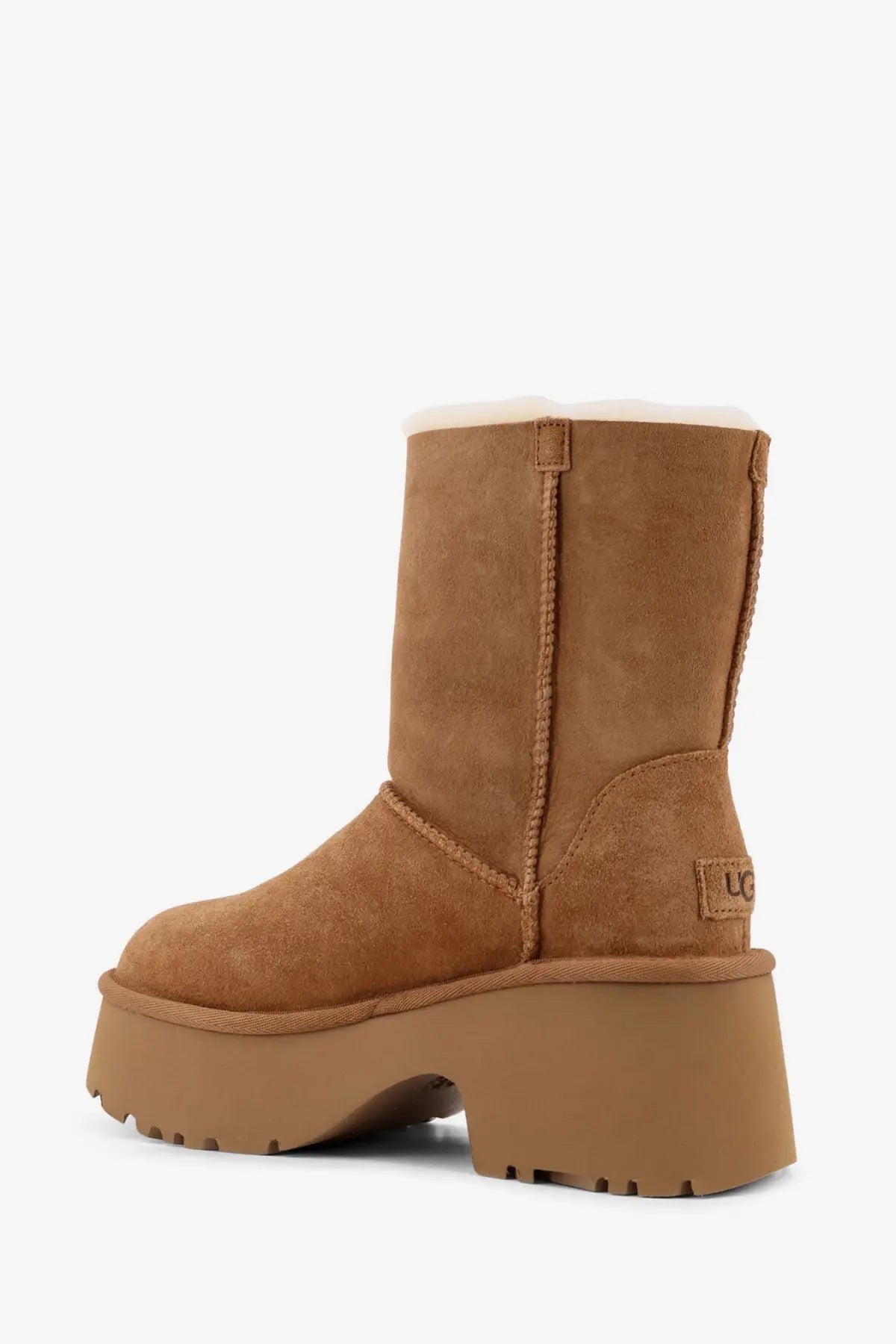 Ugg women’s Esmee tan suede boot with plush white shearling lining and chunky platform sole