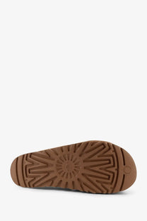 Brown rubber sole with radiating tread pattern and ugg logo embossed near heel of ugg womens goldenstar suede sandals