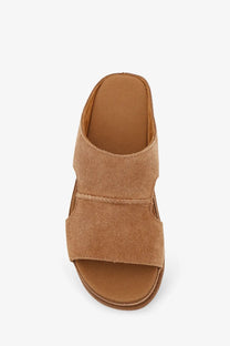 Ugg women’s goldenstar brown suede slide-on sandals with two wide straps and low wedge heel