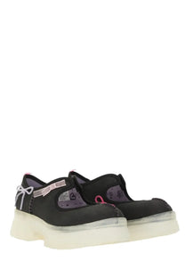 Ugg women’s mary jane areum black platform shoes with translucent white soles pink ribbon accents and sheer purple panels