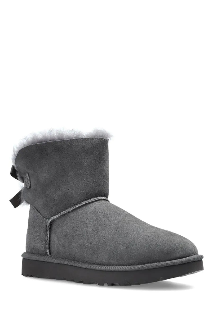 Ugg women’s mini bailey bow ii gray suede boot with white shearling lining and black bow on the side