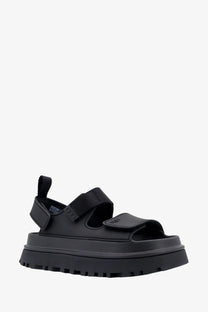 Ugg women’s black rubber platform sandal with thick sole and adjustable velcro straps front view