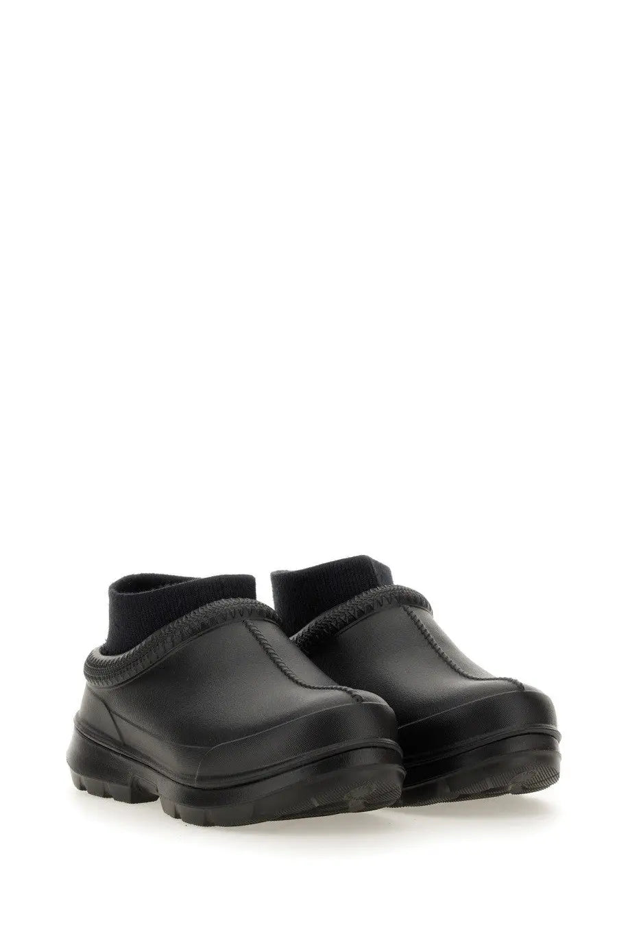 Ugg women’s sabot tasman black leather clog shoes with thick rubber sole and ribbed ankle cuff viewed from the back