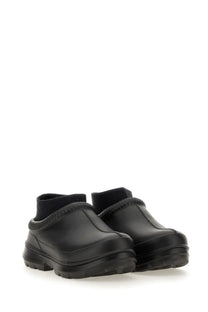 Ugg women’s sabot tasman black leather clog shoes with thick rubber sole and ribbed ankle cuff viewed from the back
