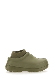 Olive green UGG women’s sabot clog made of rubber with a ribbed knit ankle cuff