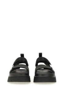 UGG women’s sandal Goldenglow black platform with two wide velcro straps and thick rubber sole