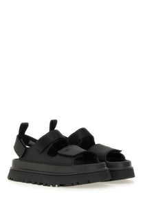 Ugg women’s sandal goldenglow black featuring black platform with wide velcro straps and chunky rubber sole